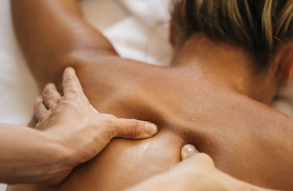 A close-up of a soothing shoulder and back massage